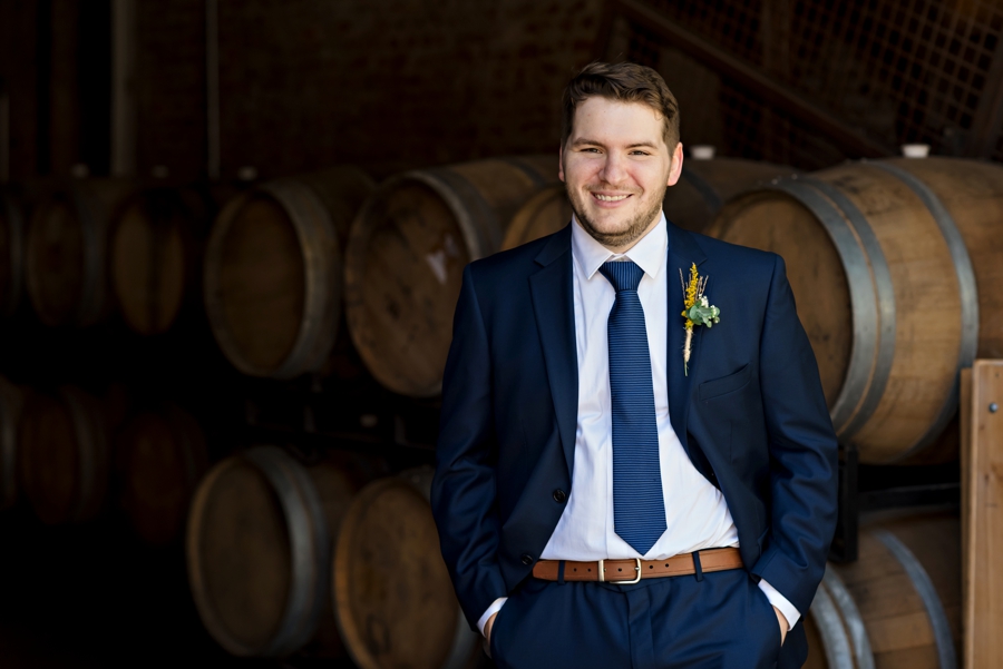 A groom waits for his bride to come down the isle.